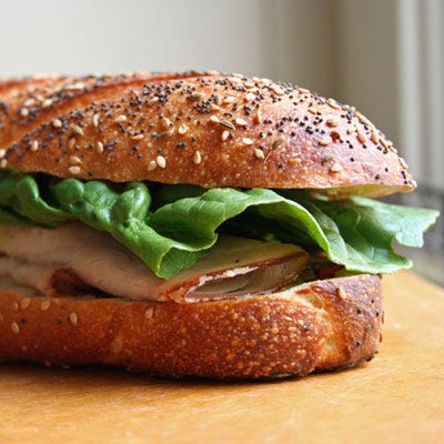 <b>Behold the Mighty Travel Sandwich</b>

Ta-da! Your sandwich is complete. The ideal travel sandwich is evenly stuffed with fixings, none of which are sticking outside of the baguette.