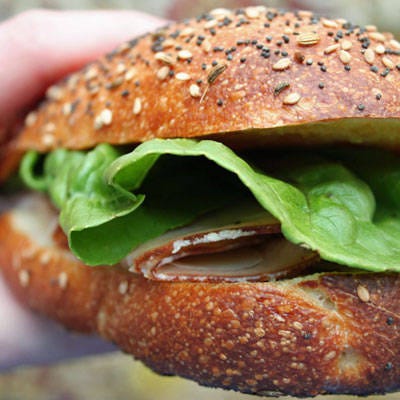 <b>Check For Comfortable Thickness</b>

Before wrapping it up, check to see that the sandwich rests comfortably in your grip. If your fingers are straining to hold onto it, then your sandwich is too thick. Take out some of those fixings, and test for thickness again. Otherwise, if it feels just right, it's time to pack it.