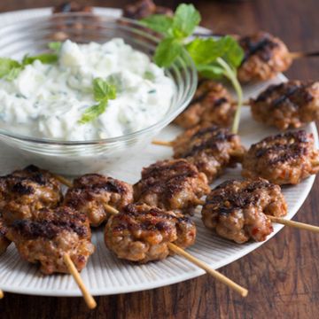 <p>Growing up, Michael Symon's Greek family always dipped their grilled meat in yogurt, a habit his friends found strange. Cooking with yogurt has become mainstream — you find it in all sorts of sauces. He's still convinced it's best on grilled meat like these kebabs, though.</p>