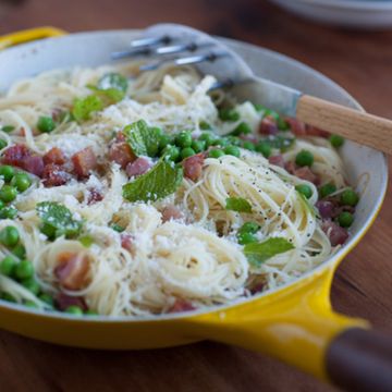 <p>In spring, sweet garden peas are at their peak of flavor—and Michael Symon makes every effort to incorporate them into his recipes, like this one. For good reason, peas and pancetta are a classic pairing: a duet of sweet and salty. Sure, you can substitute frozen peas if fresh aren't in season, but he'd rather wait until April or May and celebrate their arrival with this light, spring-y pasta.</p>