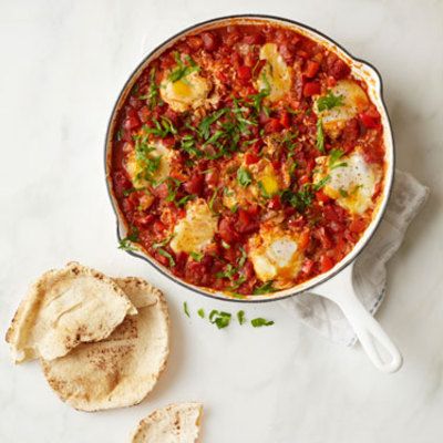 <p>Believed to have Tunisian origin, shakshuka are eggs simmered in a tomato sauce and traditionally served in a cast iron pan with bread to soak up all the flavors. After the chopping is done, this dish comes together quickly in one pot so clean-up is a breeze.</p>
<p><strong>Recipe: <a href="http://www.delish.com/recipefinder/shakshuka-eggs-spicy-tomato-sauce-recipe-rbk0413" target="_blank">Shakshuka (Eggs in a Spicy Tomato Sauce)</a></strong></p>