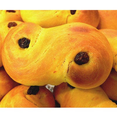 Sweden: Saffron Buns <p>On December 13, the official start of the Christmas season in many Nordic countries, citizens of Sweden and other Scandinavian nations celebrate St. Lucia's Day. On this day, tradition dictates that the eldest daughter dresses in a white gown tied with a red sash and a crown of lit candles, and comes to wake her parents with hot coffee and a tray of saffron buns like those pictured here. Swedes also elect a national Lucia every year, and many towns and villages across the country choose a Lucia to represent them as well. To give your holiday some true Swedish flavor, try our recipe for saffron buns this season.</p><p><b>Recipe: <a href="/recipefinder/saffron-buns-3882">Saffron Buns</a></b></p>