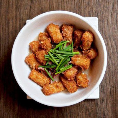 <p><b>House tater tot Swiftine, $12</b></p><p>The classic Quebecois drinking snack poutine (fries smothered in gravy and cheese curds) takes a Texas detour at this eclectic small plates hot spot. Chef Mat Clouser arranges a ring of house-made russet tater tots around a pool of smoked ham hock gravy that's amplified with Worcestershire and Tabasco sauces, plus a glossy mix of duck and pork fats. "I went to culinary school in Vermont and I spent a lot of time traveling to Montreal," says Clouser of the dish's Canadian inspiration. Meat from the braised Niman Ranch ham hocks, along with slow-melting cubes of queso fresco from a local producer, Dos Lunas, send the indulgent dish into the stratosphere.</p><p><a href="http://www.swiftsattic.com/desktop/" target="_blank"><i>swiftsattic.com</i></a></p>