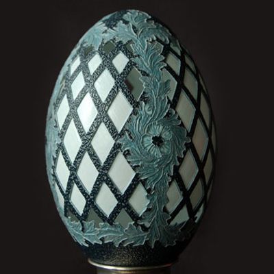 In 2008, this emu egg was picked as a finalist in Forbes magazine's Fabergé-style egg contest for its lattice and acanthus pattern. Artist Brian K. Baity says, "The most difficult part of this carving is removing the dark outer layers while keeping the 1/32-inch white layer intact."
