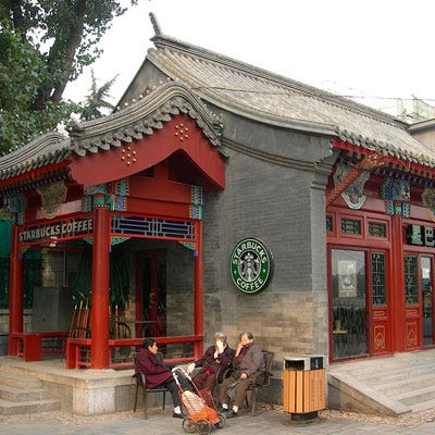Planet Starbucks <p>There are more than 18,000 Starbucks around the globe with net revenue of $3.8 billion. Everywhere you look you'll find the green mermaid, even in the most unlikely places. Case in point: the Robinson funeral home in South Carolina now has a Starbucks, as does the USS Boxer, a naval warship.</p>
<p>Starbucks employs roughly 150,000 workers — which means more people don the green apron than live in the countries of Monaco, Liechtenstein, and Greenland combined. For every nation, Starbucks tweaks its concept with a design makeover and menu items that cater to the local clientele. That's probably why the coffeehouse has been embraced by cultures around the world. We've rounded up a few of the Starbucks tha
