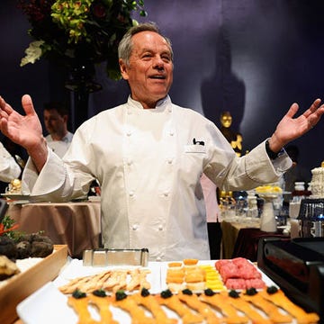 The Governors Ball — the glitzy official afterparty of the Oscars — is just over a week away. For the 19th year in a row, all eyes are on chef to the stars Wolfgang Puck, who's created what he hopes to be a blockbuster menu. We tracked down what he'll be serving at this year's soiree. Keep reading to find out the tony tastes he's planning to serve Hollywood's A-list.