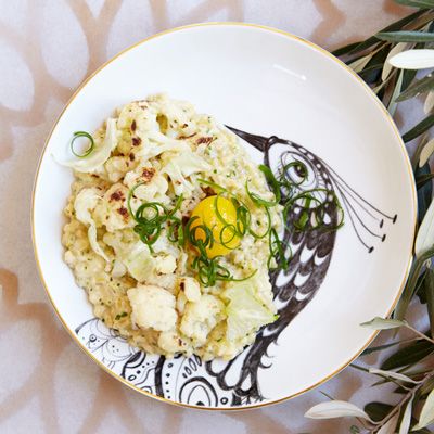 <p>This dish is inspired by a Moroccan porridge called herbel, which Mourad Lahlou's mother and grandmother used to cook for him. It's traditionally made with barley, milk, butter, and cinnamon, but Lahlou likes doing it his own way, substituting other grains such as farro instead of barley.</p><p><b>Recipe: </b><a href="/recipefinder/toasted-farro-scallions-cauliflower-egg-recipe-fw0113" target="_blank"><b>Toasted Farro and Scallions with Cauliflower and Egg</b></a></p>