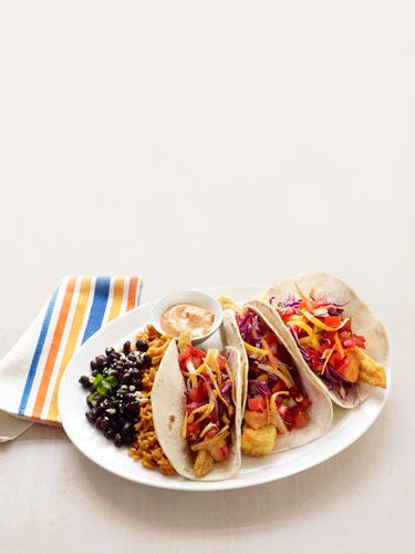 <p>Mmm... fish tacos. Ours are just as crispy (yeah, they're fried) as On the Border's, but with a third of the calories. Increíble!</p>
<p><strong>Recipe:</strong> <a href="http://gogonow.org/recipefinder/healthier-fish-tacos-recipe-rbk0911%22 target="_blank"><strong>Healthier Fish Tacos</strong></a></p>