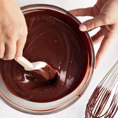 If the fat starts to separate from the cream, much like the oil in a vinaigrette, fret not. To bring a "broken" ganache back, whisk in water, 1 tablespoon at a time, until the mixture is smooth and emulsified again. Resist the impulse to add cream, which will disrupt the ratio of chocolate to fat (generally, one ounce chopped chocolate for every fluid ounce of heavy cream — plus 1/8 teaspoon coarse salt for every eight ounces chocolate).