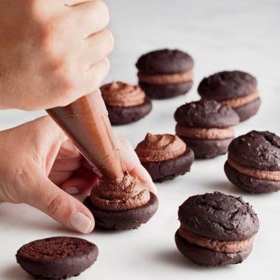 Ganache that has cooled to room temperature can be used as a whipped filling. As it cools, stir often for 45 minutes to 1 hour. Beat it with a mixer on medium-high speed until paler and fluffy, 2 to 4 minutes. (1 1/2 cups ganache will yield about 2 cups when whipped.) Transfer to a disposable pastry bag with a large opening and use it as a filling for mini whoopie pies.