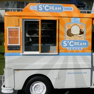The S’cream Truck has dubbed itself, "a modern take on the ice cream man." The retro-fitted mail truck has been resdisned to serve up homey fare like The S’Cream Ball and S’Cream Cups. S’cream Cups are typical flavors in a cup like vanilla bean, salted caramel, and chocolate chip, while S’Cream Balls are ice cream balls on a stick dipped in chocolate or chocolate shavings. All ice creams and products are natural and free of artificial colors or ingredients.
<br /><br />
<a href="http://www.thescreamtruck.com">thescreamtruck.com</a>