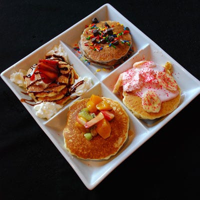 <p>The crew at Orange Restaurant take their pancakes pretty seriously. Pancake flights — which allow diners to sample smaller portions of several different types of pancakes — are constantly changing. Much like a chef's tasting menu, the weekly flight is the chef's choice (no substitutions) and the selections are often made with seasonally available ingredients, or made around a particular theme. The pictured pancake flight was created in honor of Chicago's annual Pride Parade.</p>

<p><i>Orange Restaurant, Multiple Locations, Chicago; (773) 549-7833 and (773) 248-0999; <a href="http://orangerestaurantchicago.com/" 
target="_blank">orangerestaurantchicago.com</a></i></p>

<p><b>Homemade Version:</b> <a href="/recipefinder/blueberry-pancakes-blueberry-sauce-1270"><b>Blueberry Pancakes with Warm Blueberry Sauce</b></a></p>