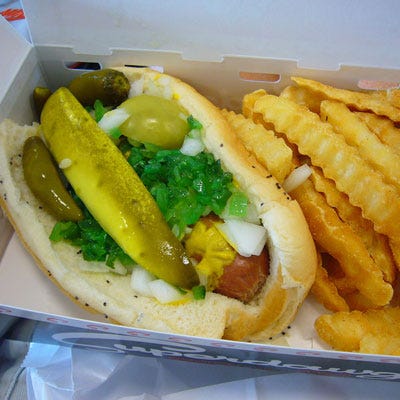 I like to tell friends they haven't really eaten a hot dog until they've eaten it "dragged through the garden" Chicago-style: all-beef Vienna hot dog, steamed poppy seed bun, mustard, onion, emerald green relish, pickle, tomato wedges, celery salt, and a sport pepper. My favorite comes from the legendary folks at <a href="http://www.superdawg.com/" target="_blank">Superdawg</a>. 