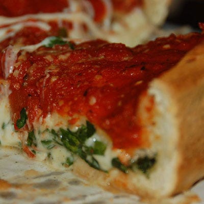 Who has the best pizza in America? That's very disputable, but Chicago has a very likely contender with its deep dish pizza. Invented at the famed <a href="http://www.unos.com/" target="_blank">Pizzeria Uno</a>, the style means an inches-high, parbaked crust made with olive oil and cornmeal and alternating servings of puréed tomatoes, sliced mozzarella, and layers of Italian sausage. 