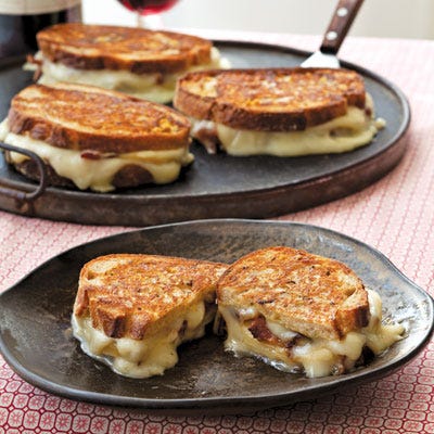 <p>"Who doesn't love a grilled cheese sandwich? I've eaten a ton of them in my life, and I still love them. But now everywhere I go restaurants feature 'comfort food,' trying to re-create the familiar grilled cheese on white bread we all grey up eating with canned tomato soup. Been there, done that (BTDT)! So I came up with this upscale grilled cheese: stinky Taleggio, crisp apples, smoky bacon, spicy Dijon, and some crunchy bread sliced not too thick, but fat with flavor. THAT, my friends, is comfort food." — Anne Burrell</p>
<p><b>Recipe:</b><a href="http://gogonow.org/recipefinder/taleggio-grilled-cheese-bacon-honey-crisp-apples-recipe-del1113?click=recipe_sr"><b>Taleggio Grilled Cheese with Bacon and Honey Crisp Apples</b></a></p>
