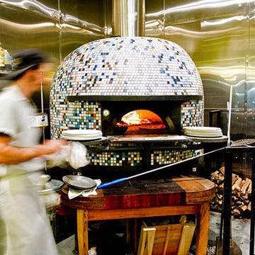 Located on one of NOLA's best foodie streets, Ancora serves the city's first authentic Neapolitan-style pizza. Chef Jeff Talbot bakes them in his prized multicolored Stefano Ferrara oven. To store toppings near the mouth of the oven, Talbot uses a table made out of old whiskey barrels and designed by Chip Martinson, the husband of F&W Best New Chef 1989 Susan Spicer. Must try: The Bianca, topped with fior di latte (a fresh, creamy mozzarella made from cow milk rather than water buffalo milk), fresh basil, olives, garlic and chile.
<br /><br />
<a href="http://www.ancorapizza.com/" target="_blank">ancorapizza.com</a>
