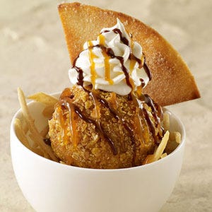 In a way, yes, says Pati Jinich, author of <i>Pati’s Mexican Table</i> and host of the same-named PBS show. And just like with chicken, the scoops of ice cream are covered in either a light flour batter or a sweet breading, such as corn flake crumbs, before being deep-fried. With chicken or fish, the cook browns and crisps the outside while completely cooking and transforming the inside ingredient, Jinich explains. Ice cream, though, has to be a “super-duper quick fry” and eaten immediately afterwards, allowing the ice cream to remain hard and cold as much as possible, while the outer layer browns and crisps. 
