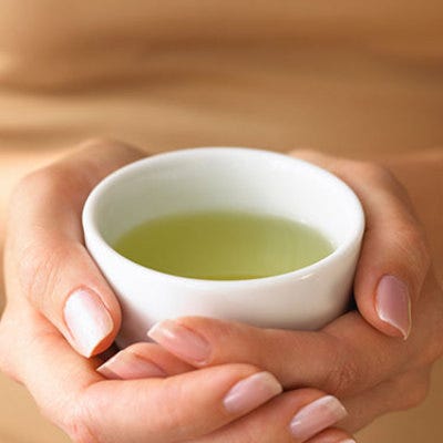 <p>The active ingredient Epigallocatechin gallate, or EGCG, in green, dandelion and ginger teas, speeds up metabolism and increases fat burn, says Dr. Shemek. That stops the expansion of fat cells that cause cellulite. Also, tea's small amount of caffeine works with EGCG to flush out toxins and dehydrate fat, which minimizes the pushing of fat cells against your skin and reduces puckering, says <a href="http://www.karlenekarst.com" target="_blank">Karlene Karst</a>, a registered dietitian in Vancouver. So why not coffee? Its higher amounts of caffeine dehydrate you too much, causing your body to hold on to liquids and toxins that expand fat under skin. </p>