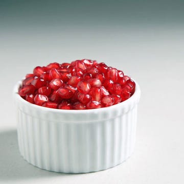 For many years I avoided <a href="http://www.yumsugar.com/Pomegranates-Season-Facts-13111431" target="_blank">buying whole pomegranates</a> for fear of juice splatter reminiscent of a crime scene, instead turning to overpriced, often bland and mushy prepackaged seeds. Since then I've rectified my ways, and realized that a few simple steps are all that separate me from the delicate juicy arils within, hold the mess. Keep reading to learn the tricks to this task.