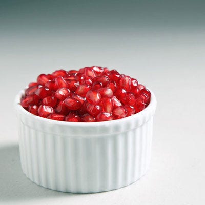 For many years I avoided <a href="http://www.yumsugar.com/Pomegranates-Season-Facts-13111431" target="_blank">buying whole pomegranates</a> for fear of juice splatter reminiscent of a crime scene, instead turning to overpriced, often bland and mushy prepackaged seeds. Since then I've rectified my ways, and realized that a few simple steps are all that separate me from the delicate juicy arils within, hold the mess. Keep reading to learn the tricks to this task.
