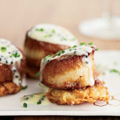 <p>This elegant pre-dinner bite screams out for a glass of Champagne to top off the rich caviar and bubbly butter sauce spooned on top of luscious scallops. It's New Years Eve wrapped up in an appetizer.</p>
<p><strong>Recipe: <a href="http://gogonow.org/recipefinder/scallops-potato-pancakes-caviar-sauce-recipe%22 target="_blank">Scallops with Potato Pancakes and Caviar Sauce</a></strong></p>