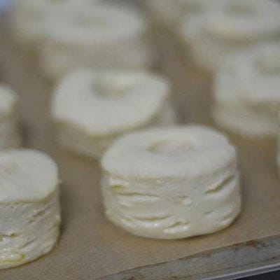 At this point, the dough needs to proof. Place on a parchment lined baking dish, cover in plastic, and let rise in a warm spot. You'll know when the dough has proofed long enough when you press it gently with your finger and it doesn't spring back immediately.
