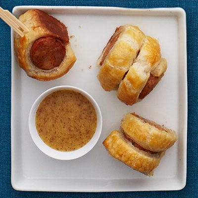 <p>Like a grown-up version of pigs in a blanket, these spicy chicken sausages are wrapped in buttery puff pastry, then baked and served with a tangy, bourbon-spiked mustard sauce.</p>
<p><strong>Recipe: <a href="http://gogonow.org/recipefinder/cajun-sausage-puffs-bourbon-mustard-recipe-rbk1211%22 target="_blank">Cajun Sausage Puffs with Bourbon Mustard</a></strong></p>