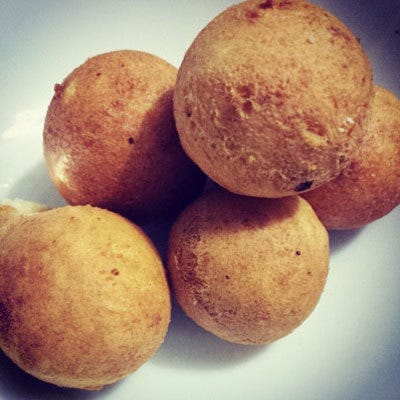 Buñuelo, Dominican Republic <p>You'll find these sweets gracing many Latin American Christmas celebrations and they come with a variety of sweet and savory fillings as well as glazes, but in the Dominican Republic they're syrupy sweet. Flavored with anise, fried, and covered in a cinnamon sugar syrup, they get an exotic touch from coconut water used in place of water in the finishing glaze. Hint: in nearby countries they're covered in honey or caramel, so pick your favorite and dip away!</p>