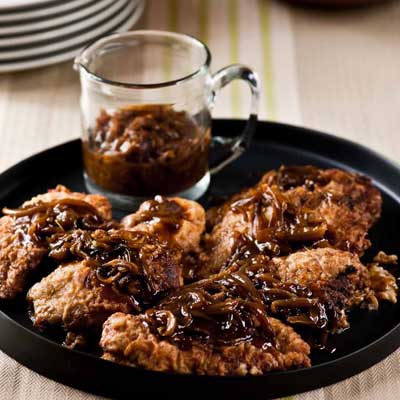 <p>A sweet tea-infused marinade tenderizes and lightens these oven-fried chicken breasts, while the accompanying caramelized-onion gravy grounds the flavor in something beyond traditional fried chicken.</p>
<p><b>Recipe:</b> <a href="http://gogonow.org/recipefinder/oven-fried-chicken-breasts-recipe-fw0910%22 target="_blank"><b>Oven-Fried Chicken Breasts</b></a></p>