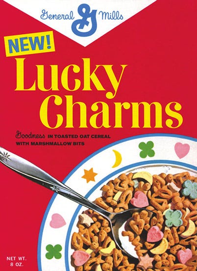 <p>John. L. Holahan, aka Mr. Cereal, developed Lucky Charms by mixing Cheerios cereal with circus peanuts marshmallow candy. </p>