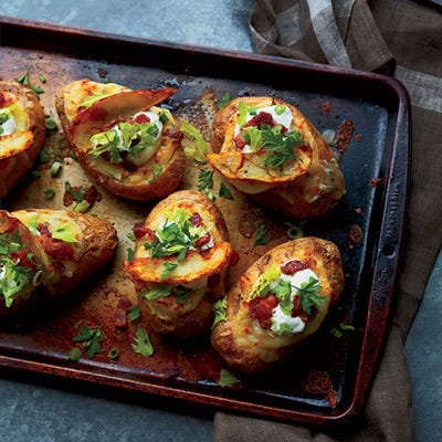 These just might be the world's best and most indulgent baked potatoes. First they're stuffed with sour cream and Parmigiano-Reggiano, then they're topped with tangy gravy, melted mozzarella, bits of crisp bacon and, finally, fried potato skins.

 Recipe: Poutine-Style Twice-Baked Potatoes