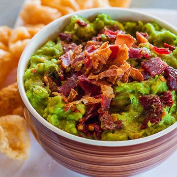<p>This smoky, salty guacamole is a great game-day dip—but you might want to double it if you're having friends over. Anything with bacon tends to disappear quickly.</p><p><strong>Recipe:</strong> <a href="http://gogonow.org/recipefinder/smoky-chipotle-bacon-guacamole-recipe-fw0214%22%3E%3Cstrong%3ESmoky Chipotle and Bacon Guacamole</strong></a></p>
