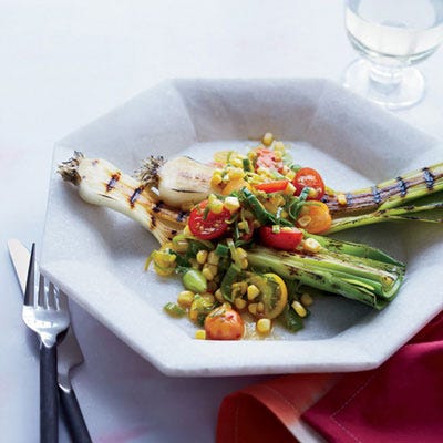 <p>Tara Duggan, author of Root-to-Stalk Cooking, uses the whole leek—grilling the bottoms in chunks and braising the sliced tops to use in a warm summer salad.</p><p><strong>Recipe:</strong> <a href="http://gogonow.org/recipefinder/grilled-leeks-tomato-salad-citrus-dressing-recipe-fw0813%22%3E%3Cstrong%3EGrilled Leeks with Leek-Tomato Salad and Citrus Dressing</strong></a></p>

