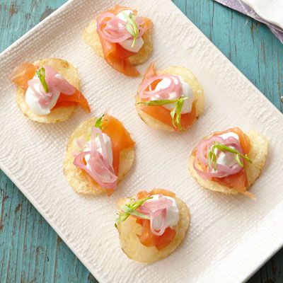 <p>These small bites are big on flavor: crunchy potato chips are topped with smoked salmon, sour cream, pickled shallots, and fresh tarragon. This effortless appetizer is sure to impress.</p><p><strong>Recipe:</strong> <a href="http://www.delish.com/recipefinder/smoked-salmon-bites-recipe-ghk0414"><strong>Smoked Salmon Bites</strong></a></p>