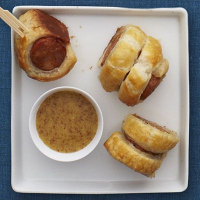 <p>Like a grown-up version of pigs in a blanket, these spicy chicken sausages are wrapped in buttery puff pastry, then baked and served with a tangy, bourbon-spiked mustard sauce.</p>
<p><strong>Recipe: <a href="http://www.delish.com/recipefinder/cajun-sausage-puffs-bourbon-mustard-recipe-rbk1211" target="_blank">Cajun Sausage Puffs with Bourbon Mustard</a></strong></p>