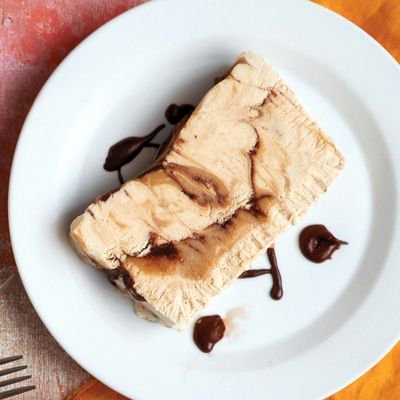 <p>The texture of semifreddo (Italian for "half-cold") lies somewhere between ice cream and mousse. Slice this freezer treat for a neat presentation, or serve it in scoops.</p>
<p><strong>Recipe: <a href="http://www.delish.com/recipefinder/peanut-butter-chocolate-semifreddo-recipe-mslo0614" target="_blank">Peanut Butter-Chocolate Semifreddo</a></strong></p>