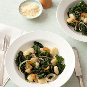 Gnocchi with Sautéed Swiss Chard <p>Traditional homemade gnocchi (little Italian dumplings) are made with just potato, flour, egg and salt. The trick here is to be sure not to work the dough too much or the gnocchi will be tough. You should stop working the dough when the ingredients are just combined and the dough is a little sticky. Always in a rush during the week? Gnocchi freeze well, so you can make a batch over the weekend when you have the time.</p>
<p>Master the traditional <a href="http://gogonow.org/recipefinder/homemade-potato-gnocchi-recipe%22 target="_blank"><strong>Homemade Potato Gnocchi</strong></a> and swap them into recipes that call for packaged gnocchi, like <a href="http://gogonow.org/recipefinder/gnocchi-sauteed-swiss-chard-recipe-122852%22 target="_blank"><strong>Gnocchi with Sautéed Swiss Chard</strong></a> (pictured), to instantly upgrade your dinner.</p>