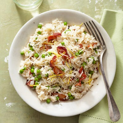 Easy Bacon and Pea Risotto <p>Risotto is a dish that has everything going for it — creaminess, lusciousness, comfort — but there are lots of things that can go wrong. To make sure your risotto is cooking evenly, don't add chilled broth or cook it in too wide of a pot (the pot should fit perfectly over your burner). Texture is just as important as temperature when it comes to this classic comfort food. Don't over cook it—risotto should be al dente, not mushy. To help it generate that creaminess, stir often, but not constantly, allowing the rice to soak up smaller amounts of broth (you want it creamy, not soupy).</p>
<p>If you're not quite up to the whole cooking process, but need a risotto fix, try <a href="http://gogonow.org/recipefinder/easy-bacon-pea-risotto-recipe-ghk0613%22 target="_blank"><strong>Easy Bacon and Pea Risotto</strong></a> (pictured), a microwave-friendly 35-minute version that's perfect in a bind. Ready to take the plunge? Top <a href="http://gogonow.org/recipefinder/risotto-balsamico-recipe-fw0912%22 target="_blank"><strong>Risotto al Balsamico</strong></a> with a generous dusting of Parmigiano-Reggiano for a simply elegant meal.</p>