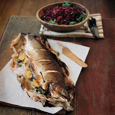 Whole Roasted Salmon with Orange Butter Glaze Roasting a whole fish looks more daunting than it is. There are a few secrets to success: First, place the salmon on cheesecloth before roasting so it will be easy to transport from pan to platter. Also, deglaze the pan before removing the fish: Pour a small amount of wine into the hot pan to loosen any part of the salmon skin that might stick.<br /><br /><b>Recipe:</b> <a href="/recipefinder/whole-roasted-salmon-orange-butter-glaze-recipe" target="_blank"><b>Whole Roasted Salmon with Orange Butter Glaze</b></a>