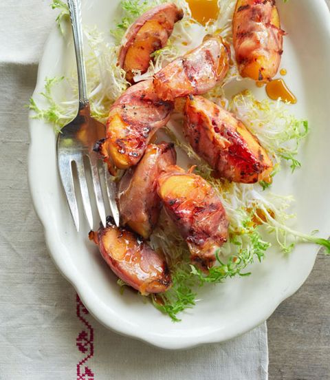 <p>Grilling peaches is an easy way to amplify their sugars and bring out that natural sweetness; smoked ham is a wonderfully salty contrast.</p>
<p><strong>Recipe: <a href="http://www.countryliving.com/recipefinder/grilled-peaches-smoked-ham-sorghum-recipe-clx0714" target="_blank">Grilled Peaches with Smoked Ham and Sorghum</a></strong></p>