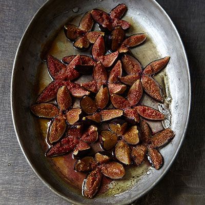 <p>Use purplish-black Mission figs, green-skinned Calimyrnas, or both for this great-tasting dessert. Give the figs a gentle squeeze to check for ripeness; they should be quite soft.</p>
<p><b>Recipe: <a href="http://www.delish.com/recipefinder/honey-baked-figs-ice-cream-recipe-7767" target="_blank">Honey-Baked Figs with Ice Cream</a></b></p>