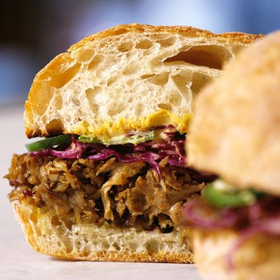 <p>This sandwich from Tom Colicchio has its origin in pork barbecue, which is often served with coleslaw. The cabbage in the sandwich — a nod to that side of slaw — is seasoned with olive oil and red wine vinegar. It is assertive and acidic, balancing the richness of the pork, while the jalapeños add a nice kick.</p><br />

<b>Recipe:</b> <a href="/recipefinder/slow-roasted-pork-red-cabbage-jalapenos-mustard-recipe" target="_blank"><b>Slow-Roasted Pork with Red Cabbage, Jalapeños, and Mustard</b></a>
