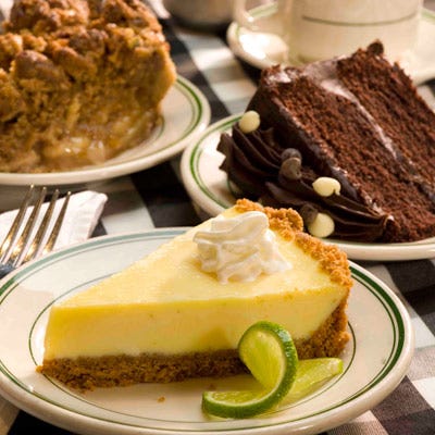 <p>In the 1950's, the only pie at the legendary Joe's Stone Crab in Miami Beach was apple pie. "But a visiting food critic from Chicago mistakenly mixed Joe's up with another restaurant and praised the Key Lime Pie," wrote Geoffrey Tomb of the Miami Herald after an interview with Jo Ann, the creator. Requests came flooding in, and Bass's father told her to develop a recipe. After a few modifications from new chefs at the restaurant, here is today's signature pie. </p><br />
<p><b>Recipe: </b><a href="/recipefinder/key-lime-pie-recipe" target="_blank"><b>Joe's Stone Crab's Key Lime Pie</b></a></p>