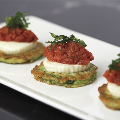 Zucchini Fritters with Fresh Buffalo Mozzarella, Stewed Grape Tomatoes, and Micro Basil from the chefs at Morrell's Wine Bar and Café in Rockefeller Center.