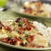 Mediterranean flavors such as sun-dried tomatoes, kalamata olives, capers, artichoke hearts, tomatoes and white wine simmer together to flavor chicken breasts in this mouthwatering slow-cooker dish. <br />