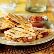 Tender chicken, green onion, salsa and Cheddar cheese are sandwiched in flour tortillas that are grilled until golden and delicious.