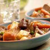 Colorful, hearty and tender, this slow-cooked stew features all the traditional ingredients of a good beef stew: beef, carrots, onion, potatoes, peas and rich beef stock.