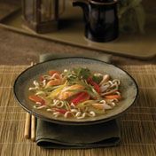 This tasteful chicken noodle soup with a zesty Asian flair features chicken broth, soy sauce, garlic, ginger and colorful vegetables, and it's ready in less than 30 minutes.