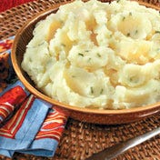 Roasted Garlic Mashed Potatoes Sweet roasted garlic adds a sophisticated note to perfectly creamy mashed potatoes made better with our secret ingredient - chicken broth.