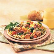 Sautéed chicken and garlic, tender vegetables and Parmesan cheese are tossed with pasta and chicken stock to make a simply flavorful, family-favorite dish.